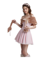 Woman wearing a pink dress with a shawl on a white background