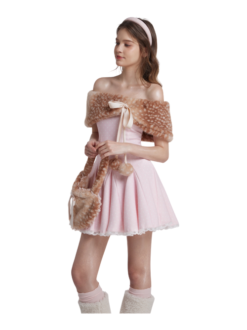 Young girl in a pink ballet outfit with fur shawl on a white background